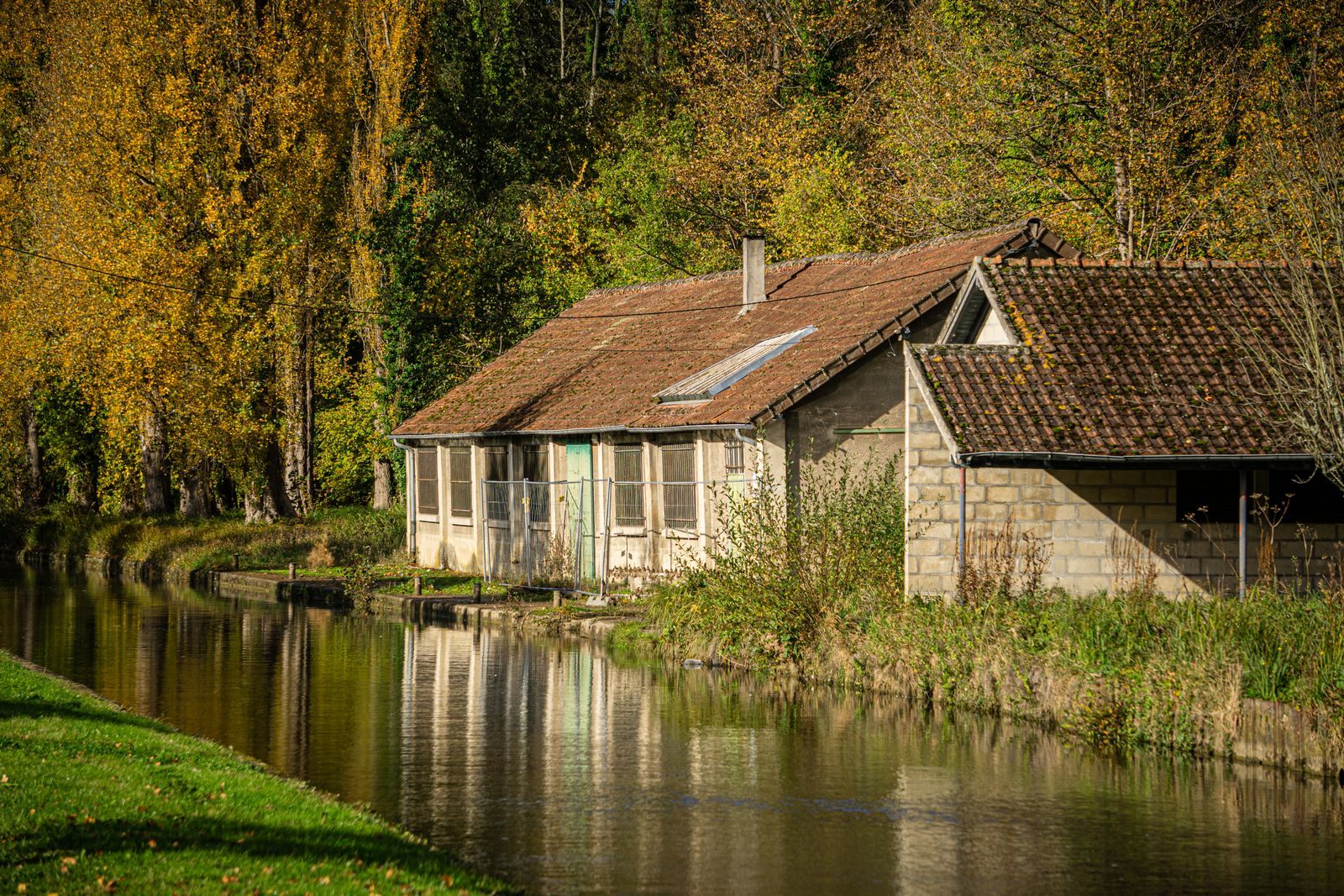 Canal-side house in autumn